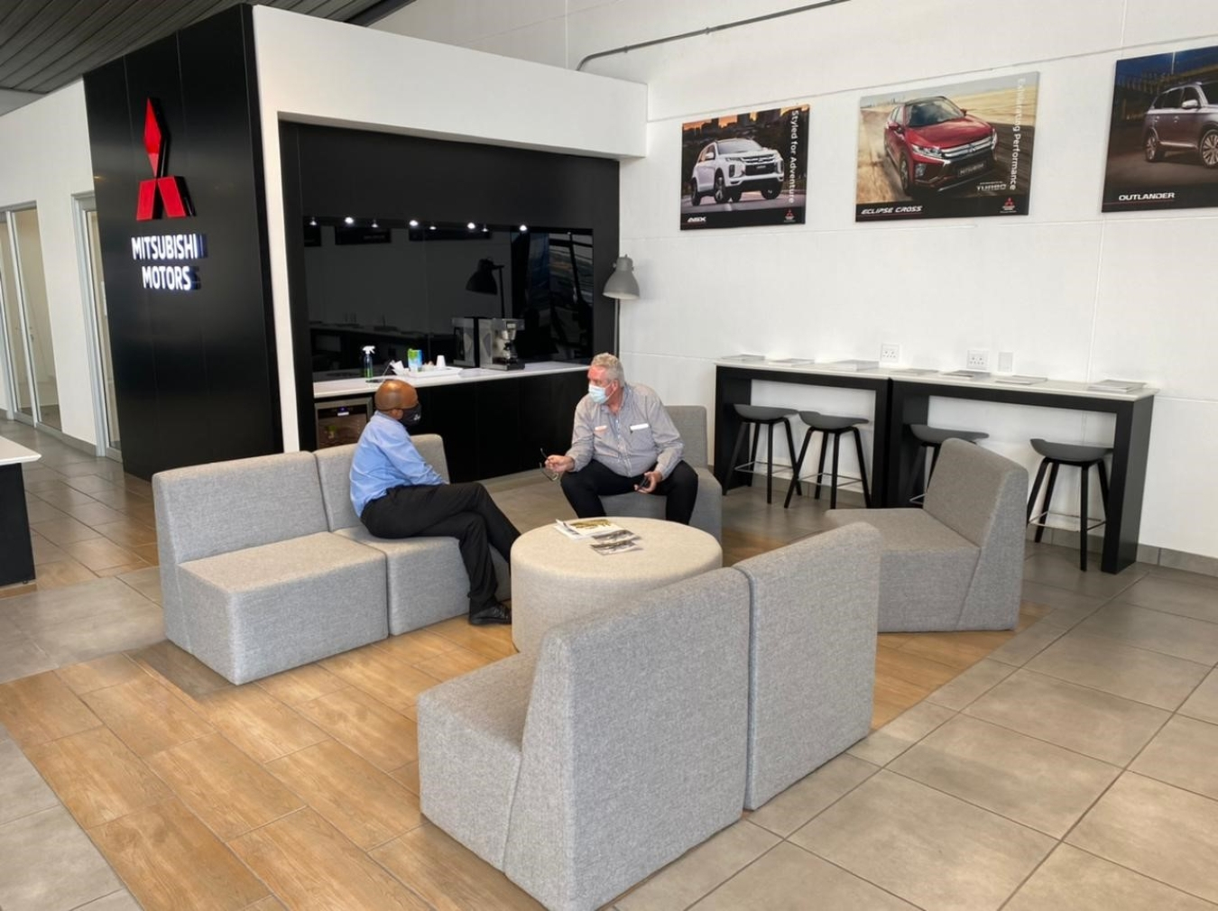 Adrian Nel, Senior Sales Executive at Mitsubishi talking to a customer.
